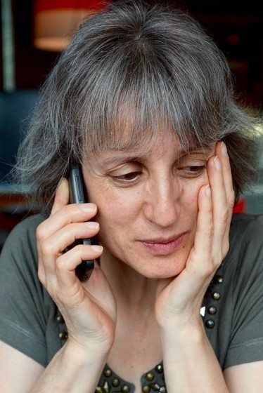 Woman on the phone calling a pedestrian accident lawyer in maine
